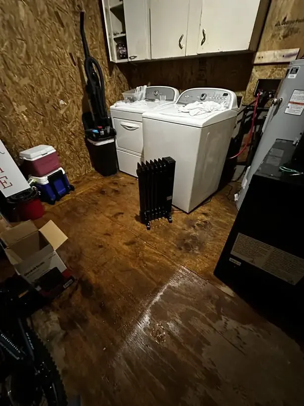 Washing machine hose leak spreading water across a floor in Columbia, MD